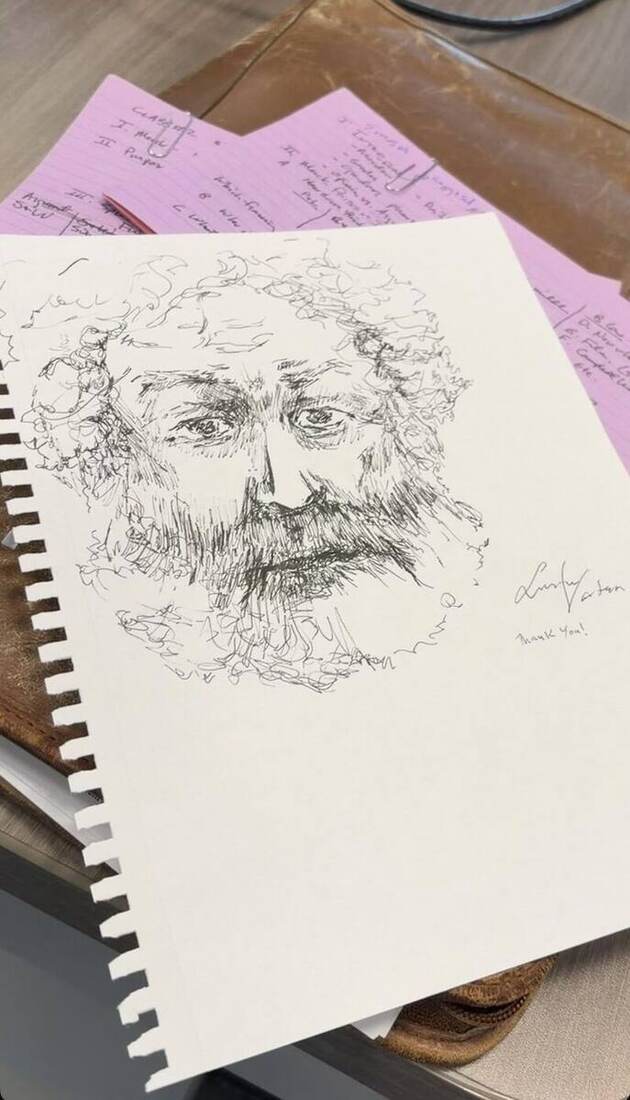 The portrait, drawn live in his class. He signed it.
